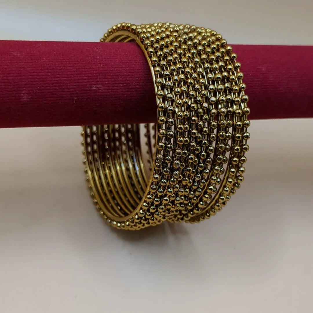Gold bangle set with 12 bangles